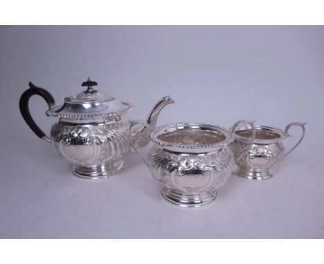 An Edward VII silver three piece Tea Service with gadroon and scroll embossing, vacant cartouches, Sheffield 1903