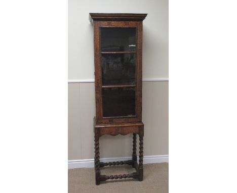 An 18th Century walnut and floral seaweed marquetry Cabinet with glazed three panel door, the sides with shaped oval panels, 