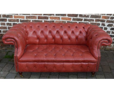 Red leather chesterfield two seater sofa, L170cm&nbsp;