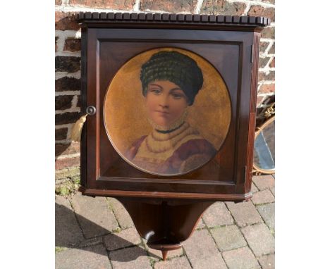 Early 20th century mahogany corner cupboard with portrait&nbsp;