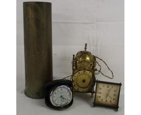 1917 brass shell casing, Smith brass electric lantern clock and 2 travelling clocks