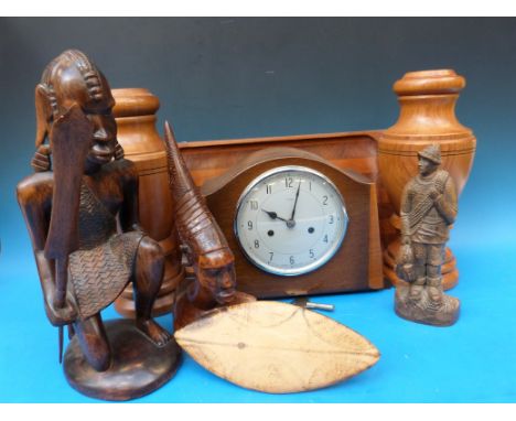 A pair of treen urns, mantel clock and various African busts 