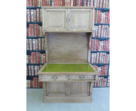 An unusual vintage pine leather inset desk / dresser with two cupboards above, two below and two drawers. The desk and cupboa