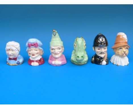 A Royal Worcester Connoisseur Collection of six candle snuffers from Punch and Judy