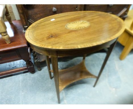 An Edwardian inlaid table with under-shelf (max diameter 61cm, H71cm)