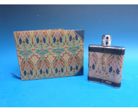 A leather covered Liberty hip flask and visitors book