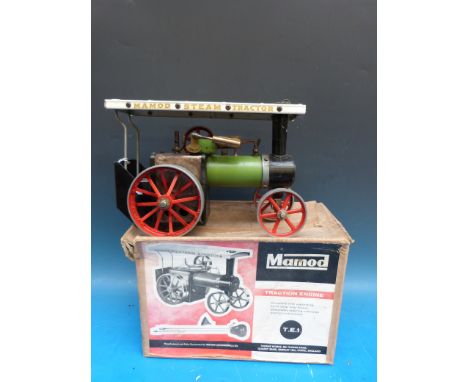 A boxed early version of a Mamod T.E.1. traction engine of nut and bolt construction with instructions, filler funnel and ste
