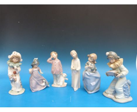 Five Nao children, two dressed as clowns, a girl with chamber sticks, a girl with puppy etc (tallest 20cm)