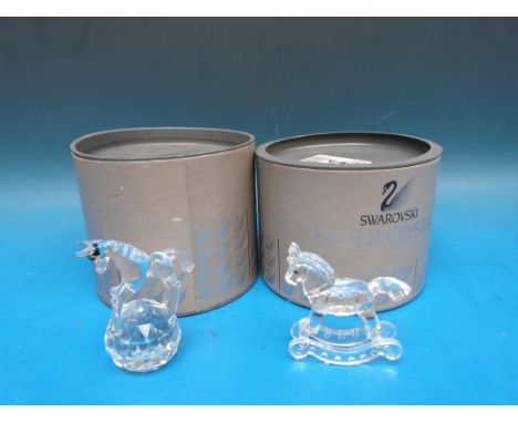 Two Swarovski crystal horses, one a rocking horse the other standing on a ball (both in original boxes) 
