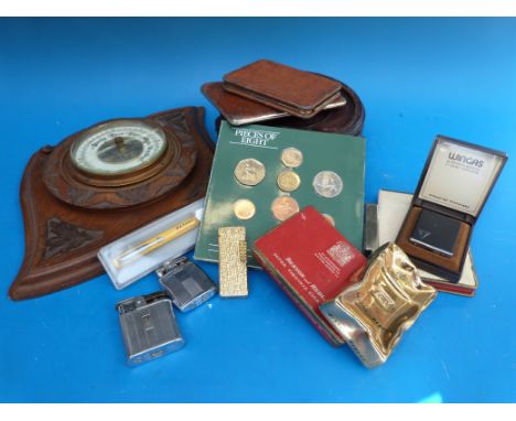 A collection of lighters, smoking related items, Chinese hardwood stand and a carved oak barometer
