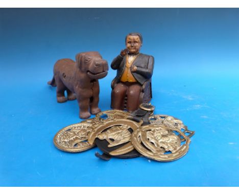 An American money box in the form of a politician pocketing money, together with a large nutcracker in the form of a dog etc 