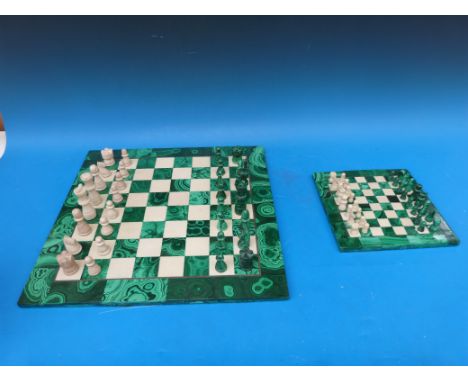 Two malachite chess boards with associated pieces