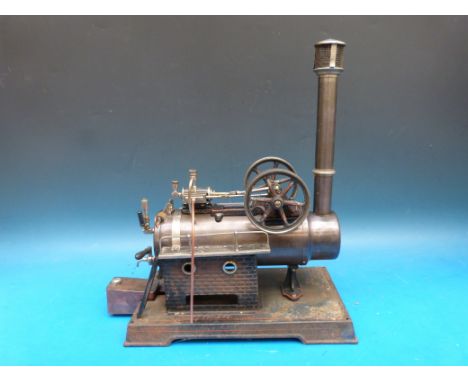 A Doll overtype steam engine with twin flywheels, single double action cylinder, twin walkways and ladders and chimney with s