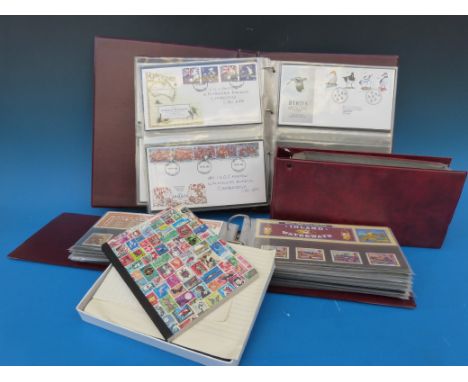 A collection of first day covers in albums