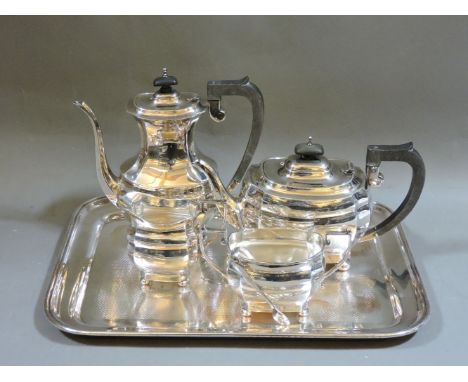 A silver four piece tea and coffee service, Bert Gordon, Birmingham 1942, a pair of silver sugar tongs, and a silver plated t