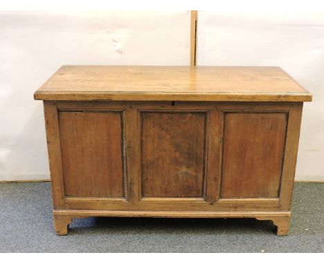 A pine coffer, with a plank top and three panel front, 100cm wide, and a folding beechwood stool