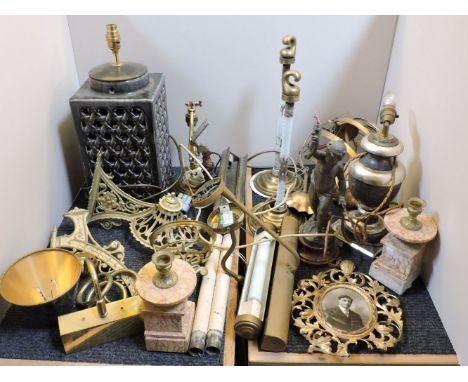 Brass and pottery table lamps, brass picture lights, spelter cherub and wood table lamps, and a pair of clock garniture candl