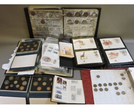 A small quantity of postage stamps and first day covers, a small quantity of humorous postcards, etc