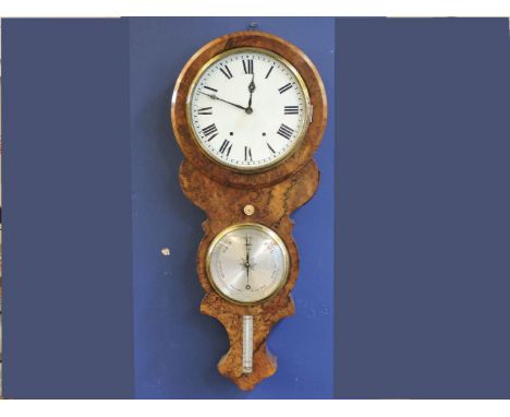 A Victorian burr walnut wall clock, with a painted enamel dial, over a silvered barometer and thermometer