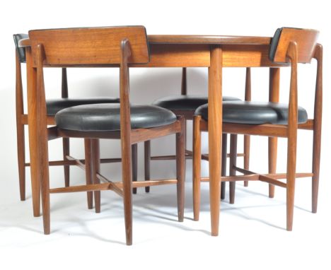 Victor B. Wilkins - G Plan - Fresco - A 1970's retro vintage teak wood extending round dining table with a set of four round 