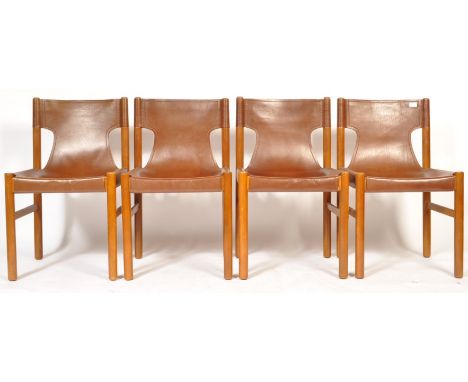 A set of four 1960's retro vintage teak wood dining / side / safari chairs . The chairs having cylindrical framed teak constr