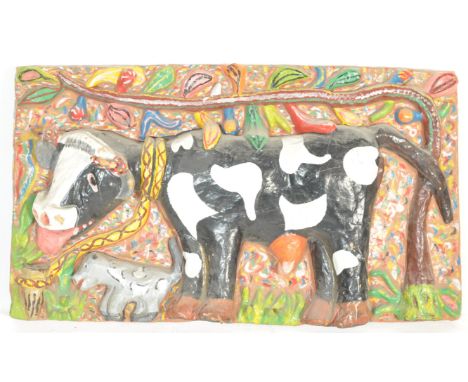 A 20th century retro vintage papiermache sculptural and pictorial wall hanging depicting a cow and it's calf.&nbsp;