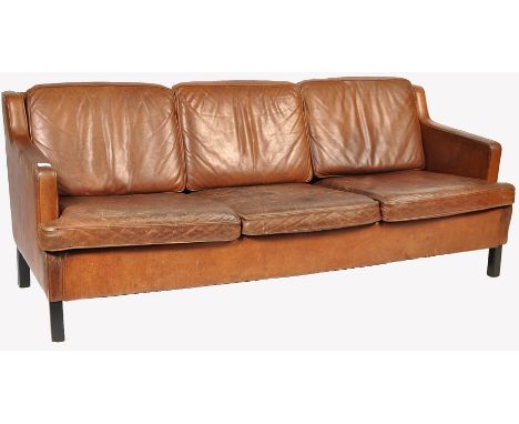 A 20th century retro vintage brown leather 3 seater sofa settee having simple design and&nbsp; clean lines in the manner of B