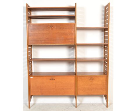 Staples - Ladderax - A 1970's retro vintage teak wood two bay wall shelving unit comprising of three wooden uprights , two la