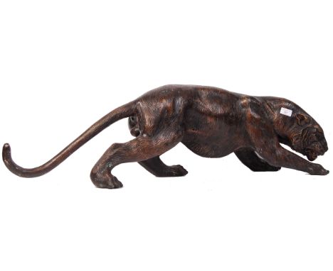 A 20th century large retro vintage hollow cast bronzed sculpture depicting a prowling / stalking tiger being highly detailed.