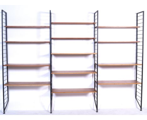 Staples - Ladderax - A 1970's retro vintage shelving wall unit comprising of 4 ebonised metal uprights creating three bays wi