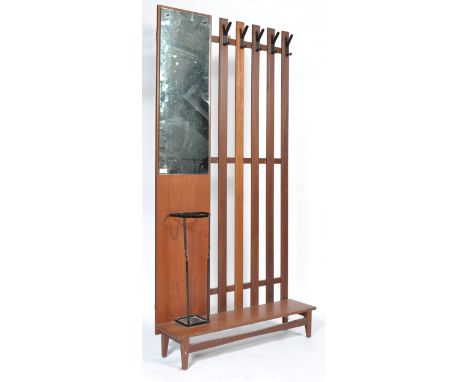 A 1970's retro vintage teak wood hall stand comprising on a slated setion with ebonised metal coat hooks and a panelled secti