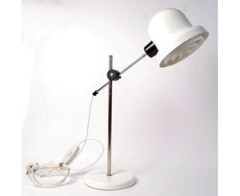 A 20th century possibly Swedish retro vintage articulated angle poise table / desk lamp having a weighted round base with chr