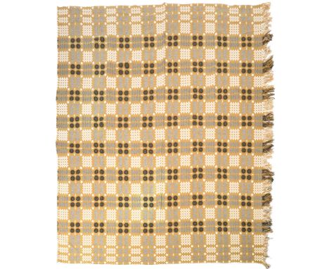 A mid 20th century retro vintage welsh blanket having geometric repeating patterns and tasselled fringe to two sides. The bla
