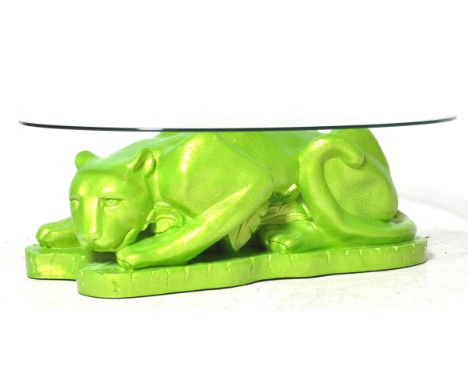 A 1960's retro vintage sculpture fibreglass panther coffee / centre table. The table comprising of a recumbent panther with j