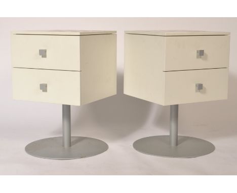 Believed Ligne Roset - A pair of contemporary laminate sleek bedroom revolving bedside chests, both having 2 drawers on metal