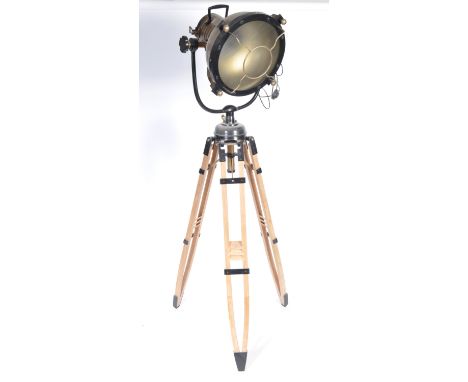 A stunning large contemporary tripod floor standing light comprising of an oversized theatre / search /cinema light / lamp st