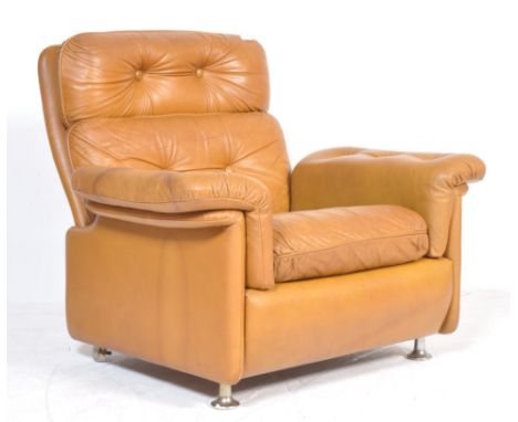 Svend Skipper - Skipper Mobler - A 20th century retro vintage tan leather armchair having button backed cushion to seat backr