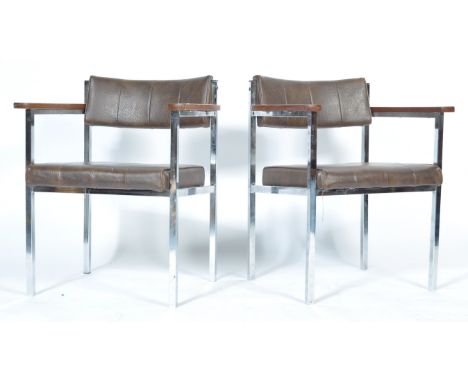 A pair of 1970's retro vintage carver dining / side chairs made from squared tubular chromed metal construction with chocolat