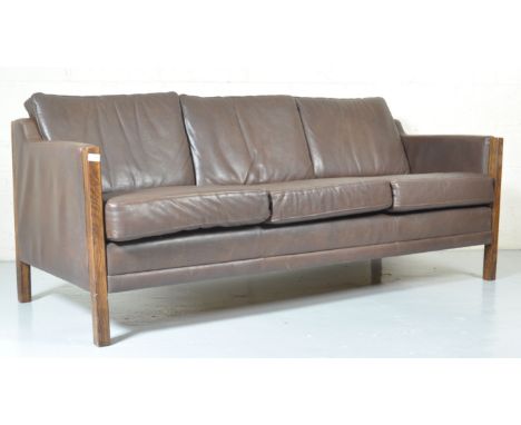 A superb 1970's Danish retro vintage chocolate brown aniline leather London type three seat sofa settee having stepped side a