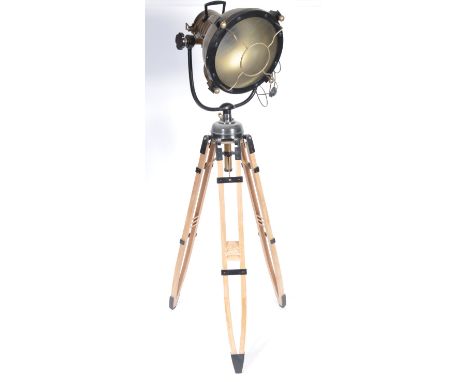 A stunning large contemporary tripod floor standing light comprising of an oversized theatre / search /cinema light / lamp st
