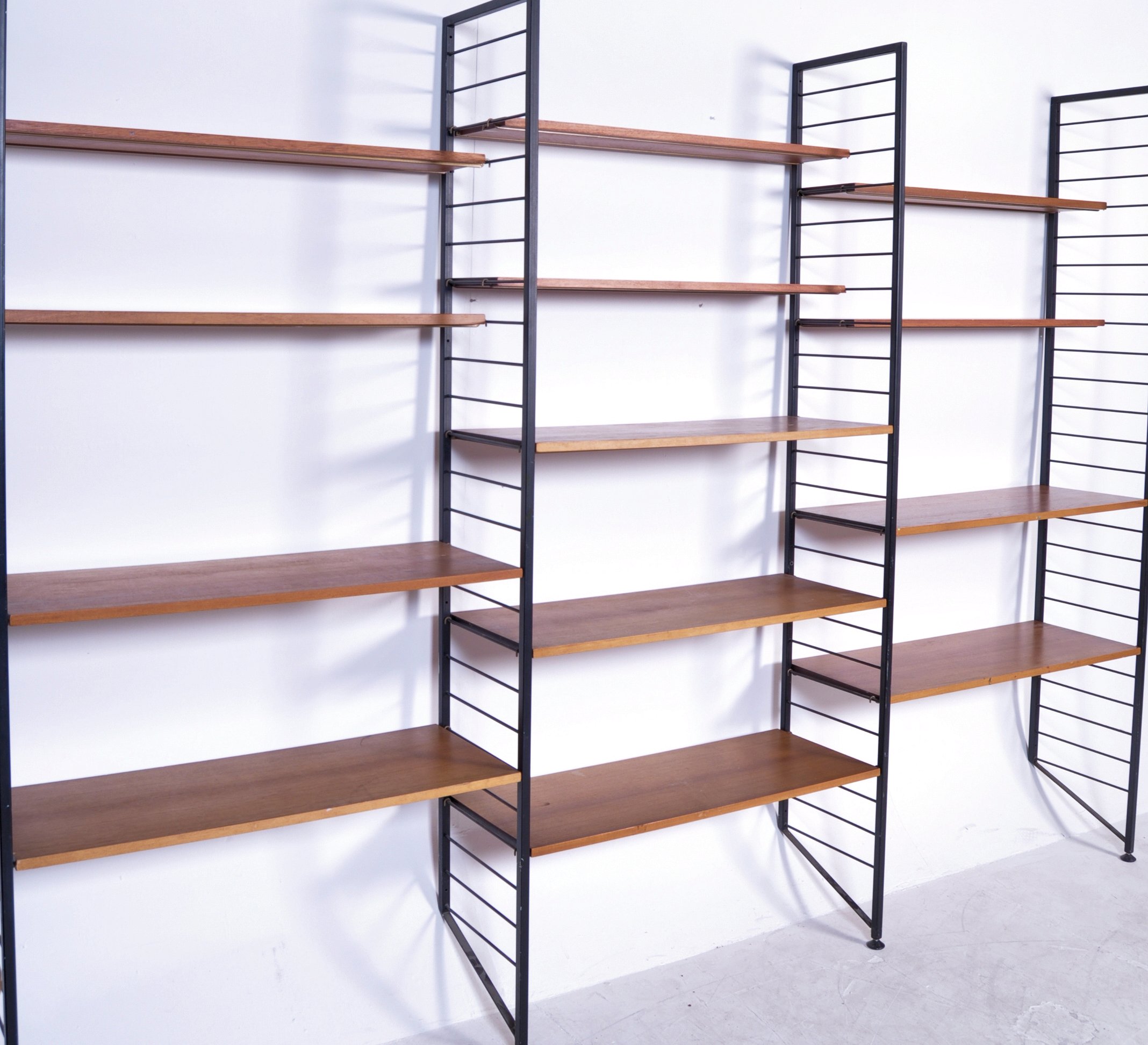 Staples Ladderax A 1970's retro vintage shelving wall unit comprising of 4 ebonised metal upr