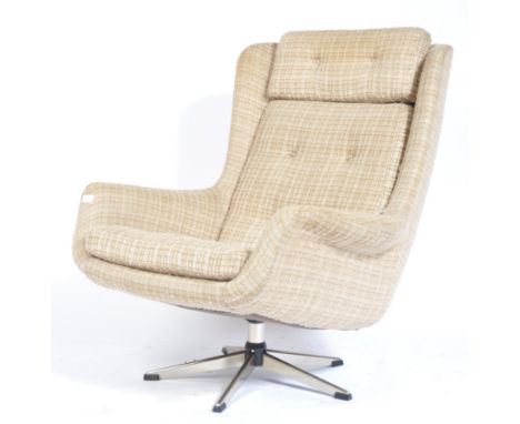 A 1970's Danish retro vintage swivel chair / armchair upholstered in a woven wool material, each cushion being button backed 