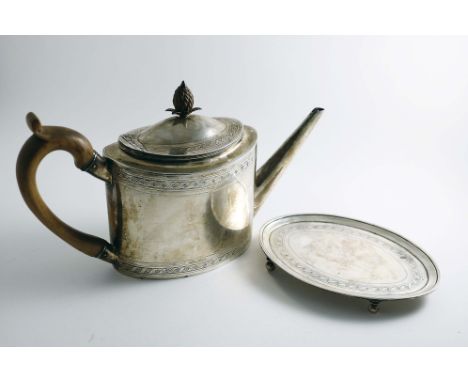 A GEORGE III OVAL TEA POT with a pineapple finial, and a matching oval stand, decorated with pricked borders of wrigglework a