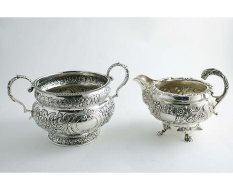 A GEORGE IV IRISH EMBOSSED SUGAR BASIN circular with decorative scroll handles and two vacant cartouches, by Edward Power, (r