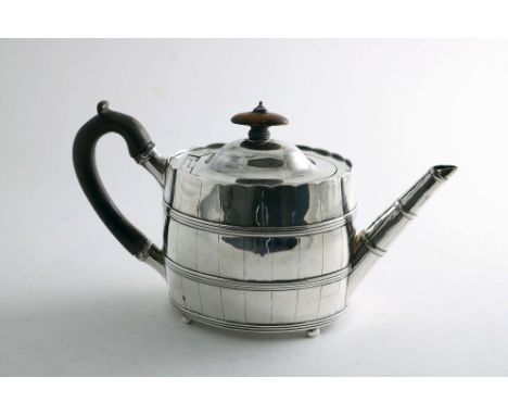 A GEORGE III OVAL TEA POT with engraved staves and applied reeded hoops to simulate a coopered construction, domed cover &amp