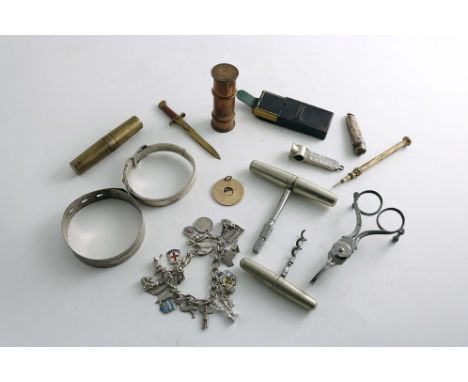 A MIXED LOT:- An Edwardian 9 ct. gold circular cigar cutter, by William Hornby, London 1905, an Edwardian mounted nickel ciga