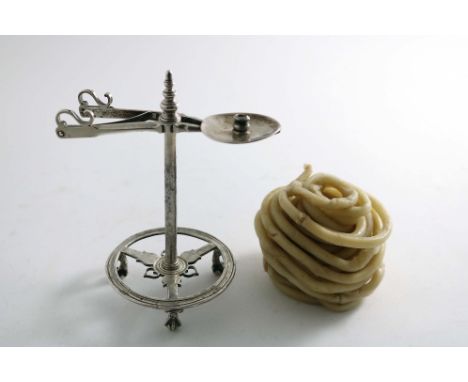 A GEORGE III WAX JACK on an openwork circular base with ball &amp; claw feet, with a sprung clip and an acorn finial, crested