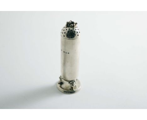 A MID 20TH CENTURY PEPPER CASTER of cylindrical form with fruiting legs, a circular base and a domed cover with fruit finial,