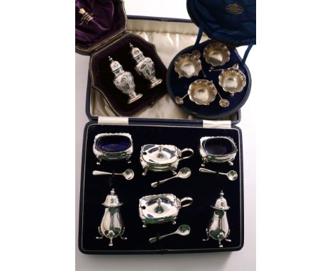 A CASED PAIR OF EDWARDIAN PEPPERETTES by R. Martin &amp; E. Hall, Sheffield 1901, a cased set of four small Victorian salts &