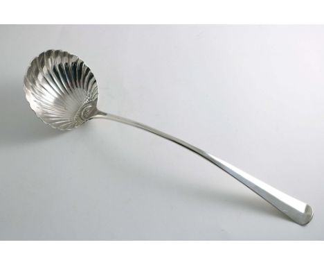 A GEORGE III IRISH PROVINCIAL SOUP LADLE Hanoverian pattern with a fluted circular bowl, engraved on the back of the terminal